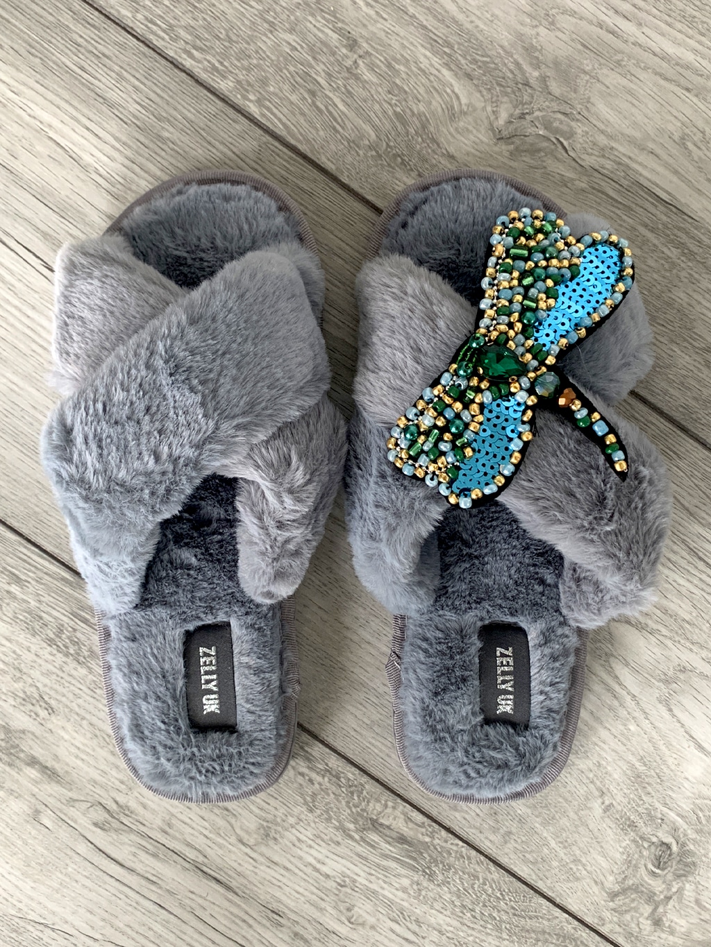 Grey slippers with dragonfly embellishment