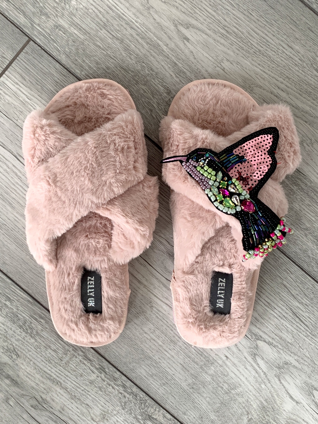 Pink slippers with hummingbird embellishment