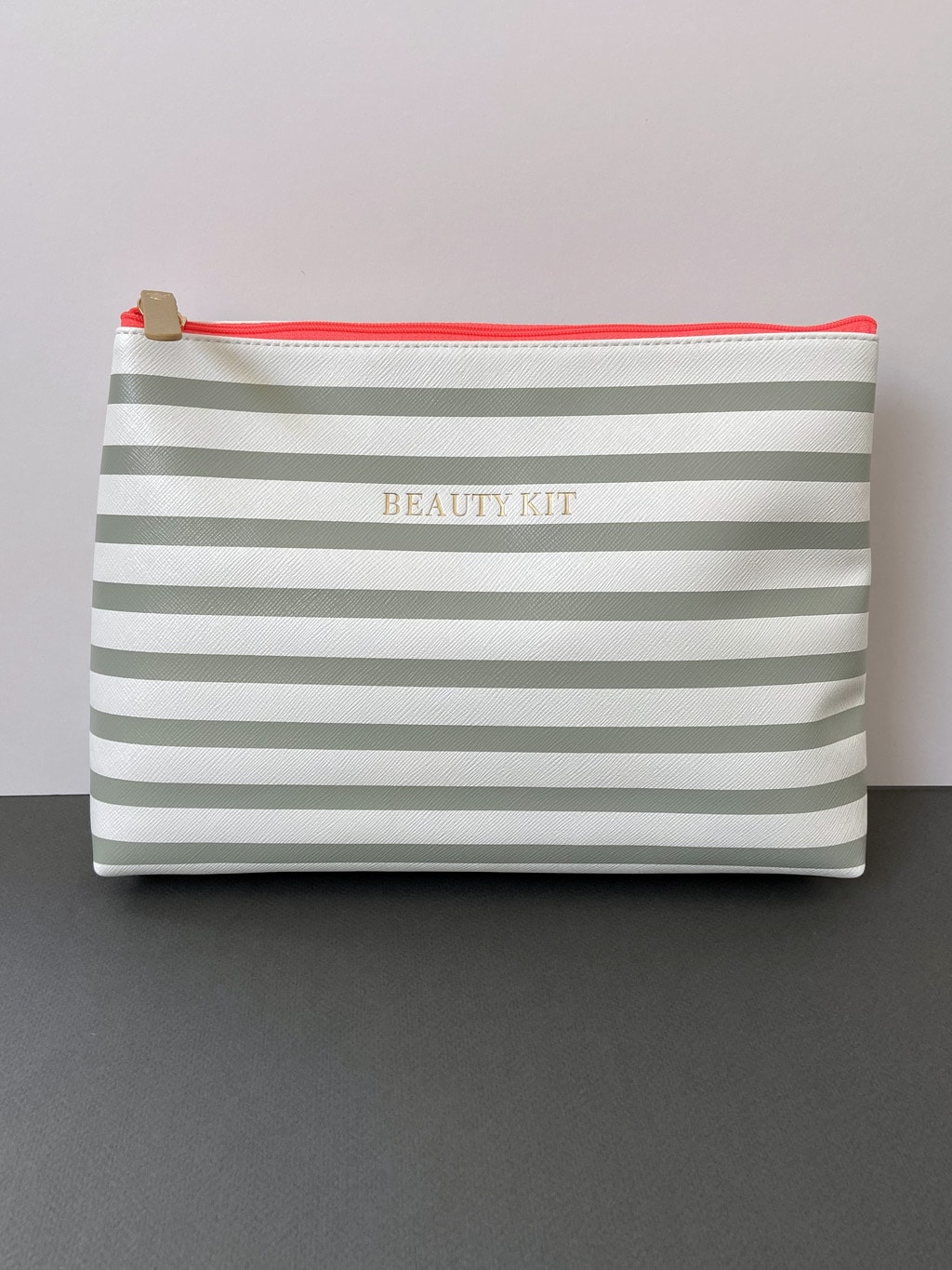 Grey striped cosmetic bag